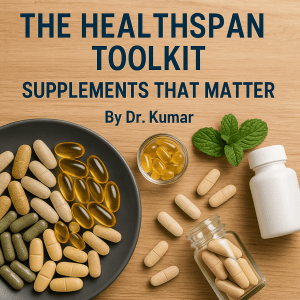 Flat-lay of assorted supplement capsules and tablets with mint leaves and bottle on wood, titled “The Healthspan Toolkit: Supplements That Matter.”